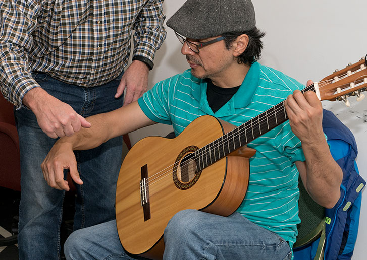Harry shows a student proper hand position